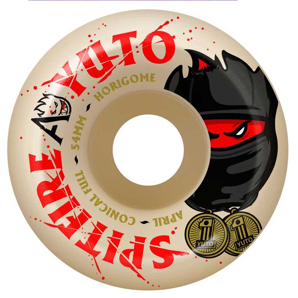 The Yuto Horigome April 54mm 99A Spitfire Wheels Skateboard feature a beige design with bold red "YUTO" and "SPITFIRE" text, playful cartoon ninja and cat faces, gold medal accents, and the classic 54mm 99A profile—an ideal choice for skateboarders who want quality wheels with standout style.