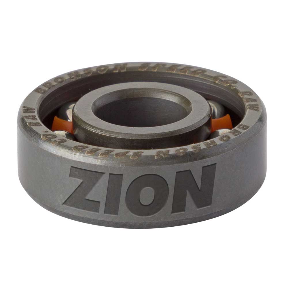 A close-up view of a shield-free bearing, specifically the Zion Wright Pro 6 Ball RAW Bronson Speed Co. Skateboard Bearing, with the word ZION engraved on the side; bright orange balls are visible inside this high-speed skateboard bearing.