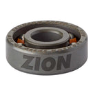 A close-up view of a shield-free bearing, specifically the Zion Wright Pro 6 Ball RAW Bronson Speed Co. Skateboard Bearing, with the word ZION engraved on the side; bright orange balls are visible inside this high-speed skateboard bearing.