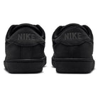 Back view of Zoom Tennis Classic HF7386003 Black Black Suede Nike SB Skateboarding Shoes, showing a tennis-inspired leather sneaker with the word NIKE embossed on the heel tabs.