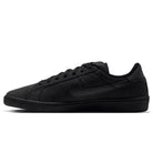 Side profile of a black Zoom Tennis Classic HF7386003 Black Black Suede Nike SB Skateboarding Shoe, featuring a matching midsole and swoosh logo in a tennis-inspired style.