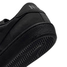 Close-up of the heel and sole of a black Zoom Tennis Classic HF7386003 Black Black Suede Nike SB Skateboarding Shoe, featuring a textured rubber tread.