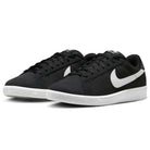 A pair of Zoom Tennis Classic HF7386004 Black White Suede Nike SB Skateboarding Shoes with white swooshes and rubber soles, shown at a slight angle on a white background.