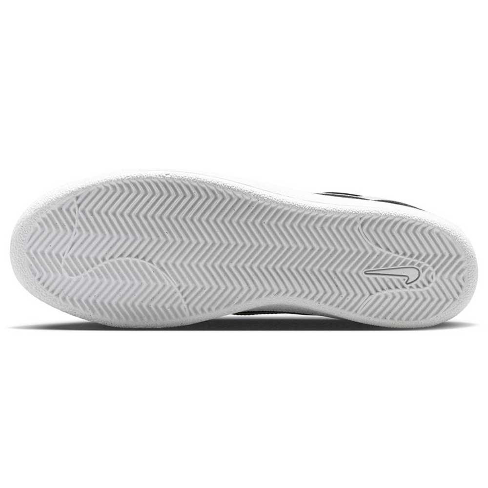 The image displays the white sole of the Zoom Tennis Classic HF7386004 Black White Suede Nike SB Skateboarding Shoe, featuring a herringbone tread pattern and a small Nike Swoosh logo near the arch.