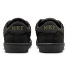 A pair of Zoom Tennis Classic HF7386200 Deep Pewter Medium Olive Suede Nike SB skateboarding shoes viewed from the back, each heel displaying NIKE in capital letters and featuring a comfortable Solarsoft insole.