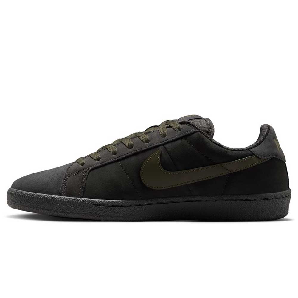 The Nike SB Zoom Tennis Classic HF7386200 skate shoe features deep pewter and medium olive suede, with a black sole and matching laces, a medium olive Nike swoosh, cushioned Solarsoft insole, shown in side profile on a white background.