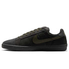The Nike SB Zoom Tennis Classic HF7386200 skate shoe features deep pewter and medium olive suede, with a black sole and matching laces, a medium olive Nike swoosh, cushioned Solarsoft insole, shown in side profile on a white background.