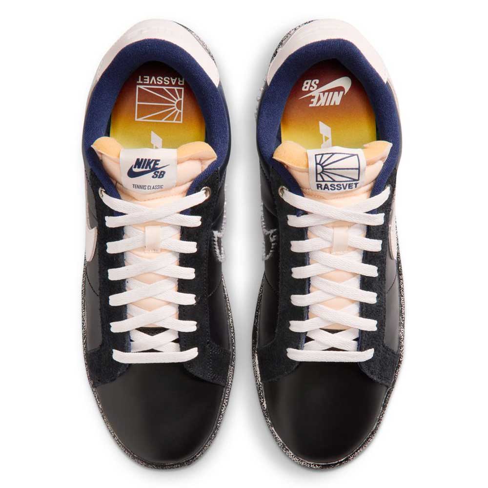 Top view of the Zoom Tennis Classic x Rassvet IO9846400 Blue Void Sail Nike SB leather skateboarding shoes with white laces and soles, peach tongue, blue lining, and Rassvet branding on the insole alongside Nike SB logos.