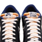 Close-up of Zoom Tennis Classic x Rassvet IO9846400 Blue Void Sail Nike SB leather skate shoes with white laces. The left tongue shows the Nike SB logo, while the right features the Rassvet sun logo on a white patch.