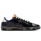 The Nike SB Zoom Tennis Classic x Rassvet IO9846400 skate shoe features blue void and sail leather, a dotted white Swoosh, orange tongue detail, dark blue heel, cream toe cap, black speckled sole, and a comfortable Solarsoft insole. Side view on white background.