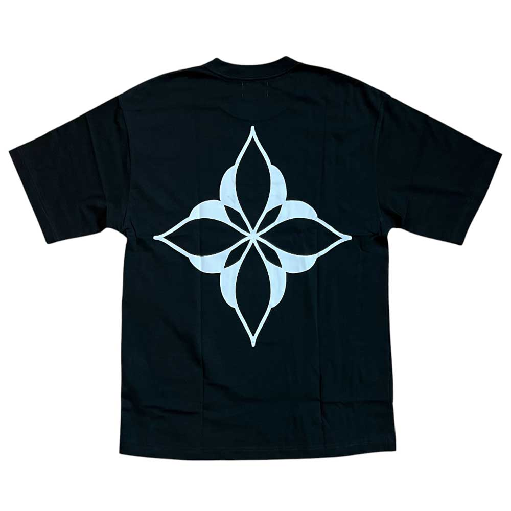 Introducing the Cleo Icon Black Tee—an expertly crafted black t-shirt featuring premium cut-and-sew construction for a superior fit. The centerpiece of its design is a bold, white geometric motif on the back, showcasing four pointed, petal-shaped elements arranged in a strikingly symmetrical, flower-like pattern.