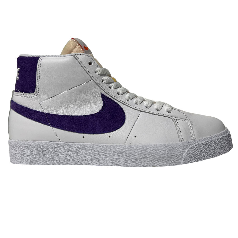 The DZ4949-100 Court Purple White Blazer Mid Nike SB leather skateboarding shoe features a white high-top design, purple swoosh, white laces, and textured sole, shown in side profile against a plain background.