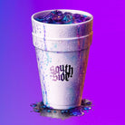 A white styrofoam cup labeled “South Side,” filled with purple liquid and ice, sits against a purple gradient—echoing the vintage vibe of the Southside Double Cup T-Shirt Multicolor Tee, with a splash spilled at its base.