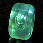 Translucent green 53mm Spitfire Wheels Sapphire 53mm90A Clear Green Conical Full skateboard wheel featuring a flaming skull logo printed on the side.