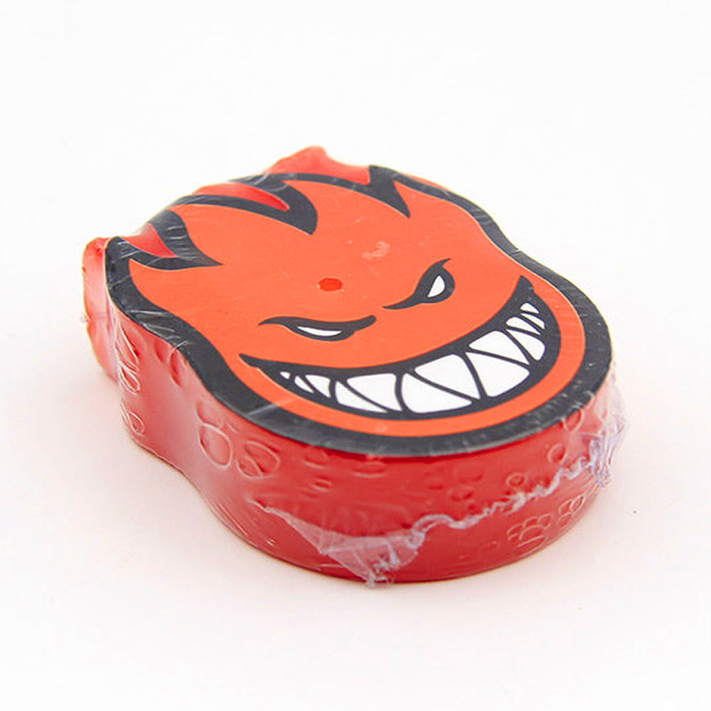 Red Spitfire Wax Embers Mini shaped like the flaming head of an Embers Mini character with an angry face.
