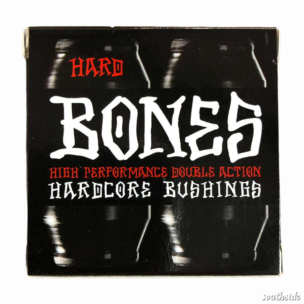 A hard black box displays bold white text "Bones Hardcore Bushing Hard Black" and red "High Performance Double Action," with a grunge design of repeated vertical reflections—ideal for showcasing these skateboard bushings.