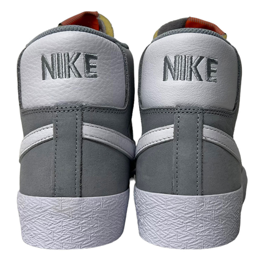 Nike SB Blazer Mid DV5467001 White Wolf Grey Shoes seen from the back feature white panels with gray NIKE embroidery and textured rubber soles—perfect skateboarder sneakers offering responsive cushioning for comfort and style.